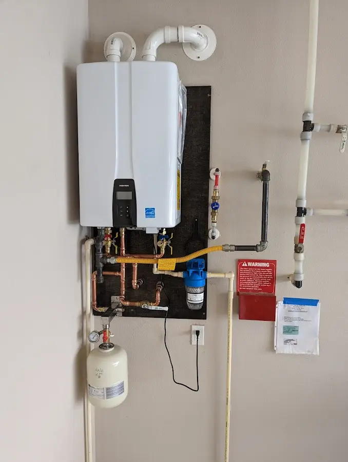 Professional plumber installing copper piping in a Worth home